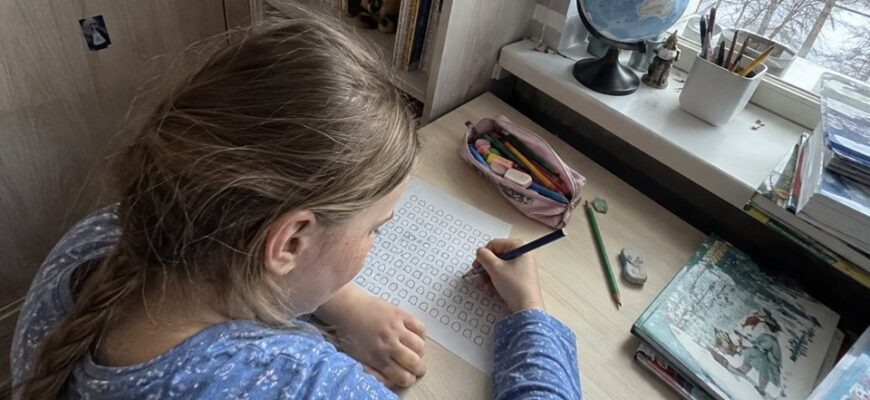 A girl completing a symbol search activity